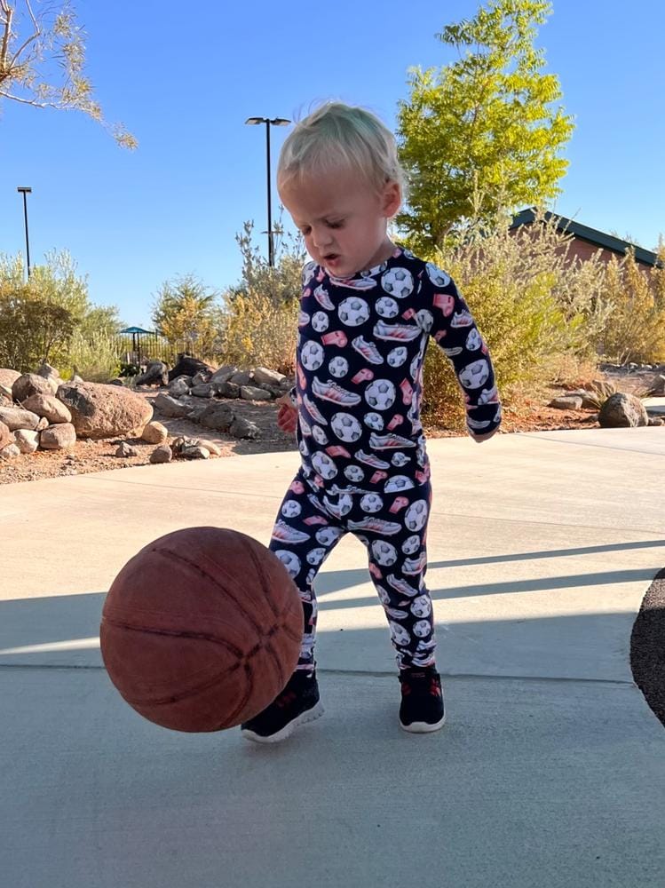 Customer photo: boy playing with a ball in pajamas