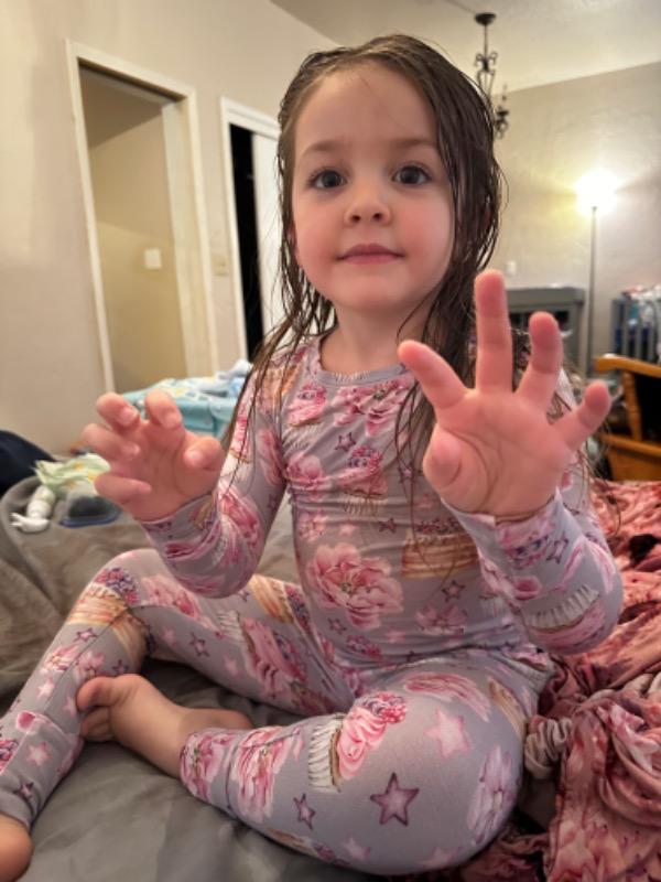 Customer photo: girl waving in floral pajamas